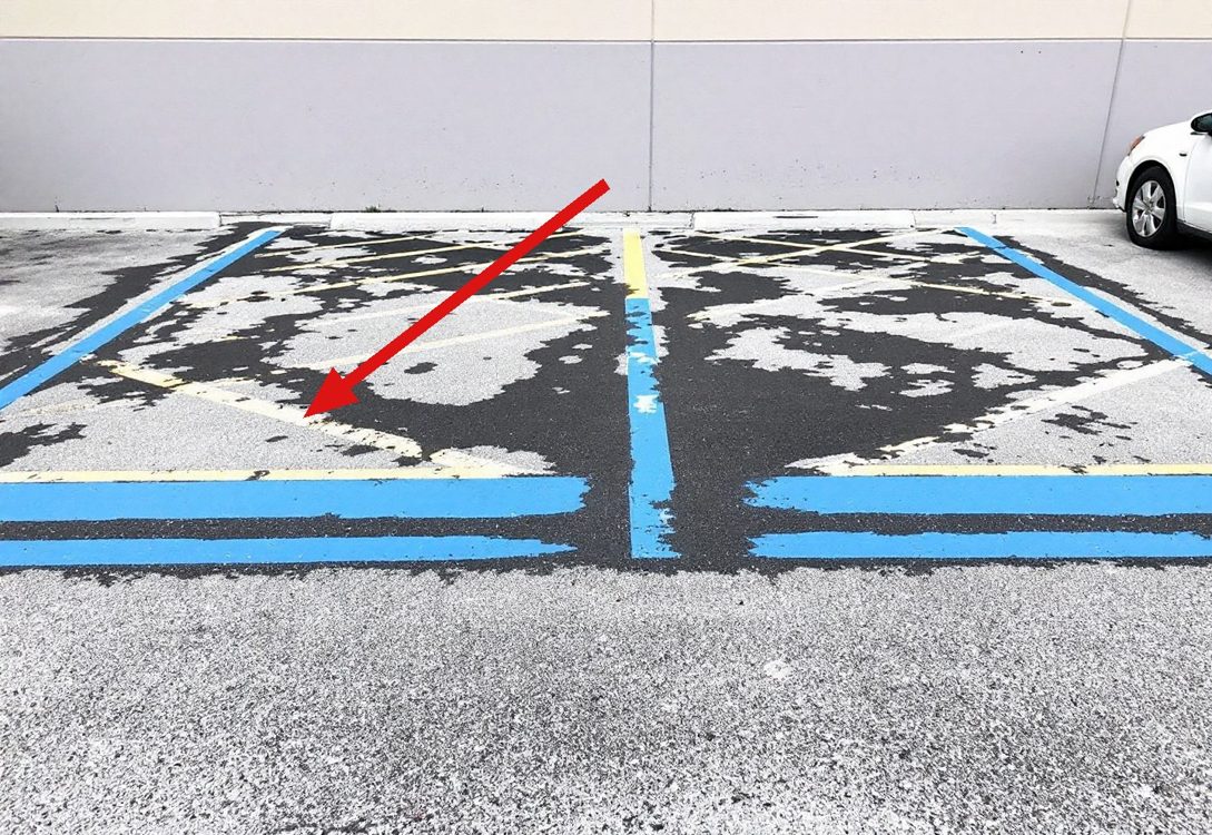 Illustration: faded accessible parking markings
