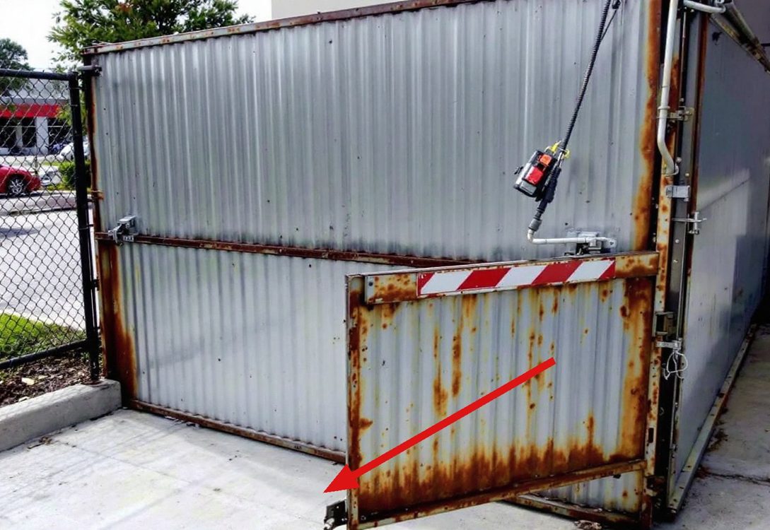 Illustration: rusted dumpster enclosure gate