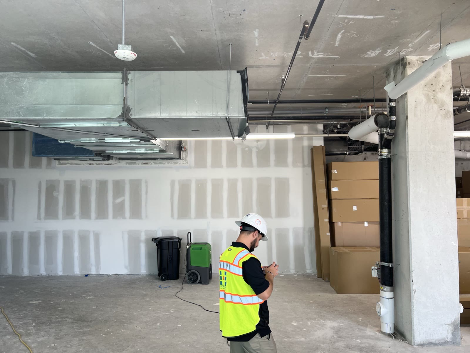 Commercial shell space with new ductwork and sprinkler lines before tenant occupancy